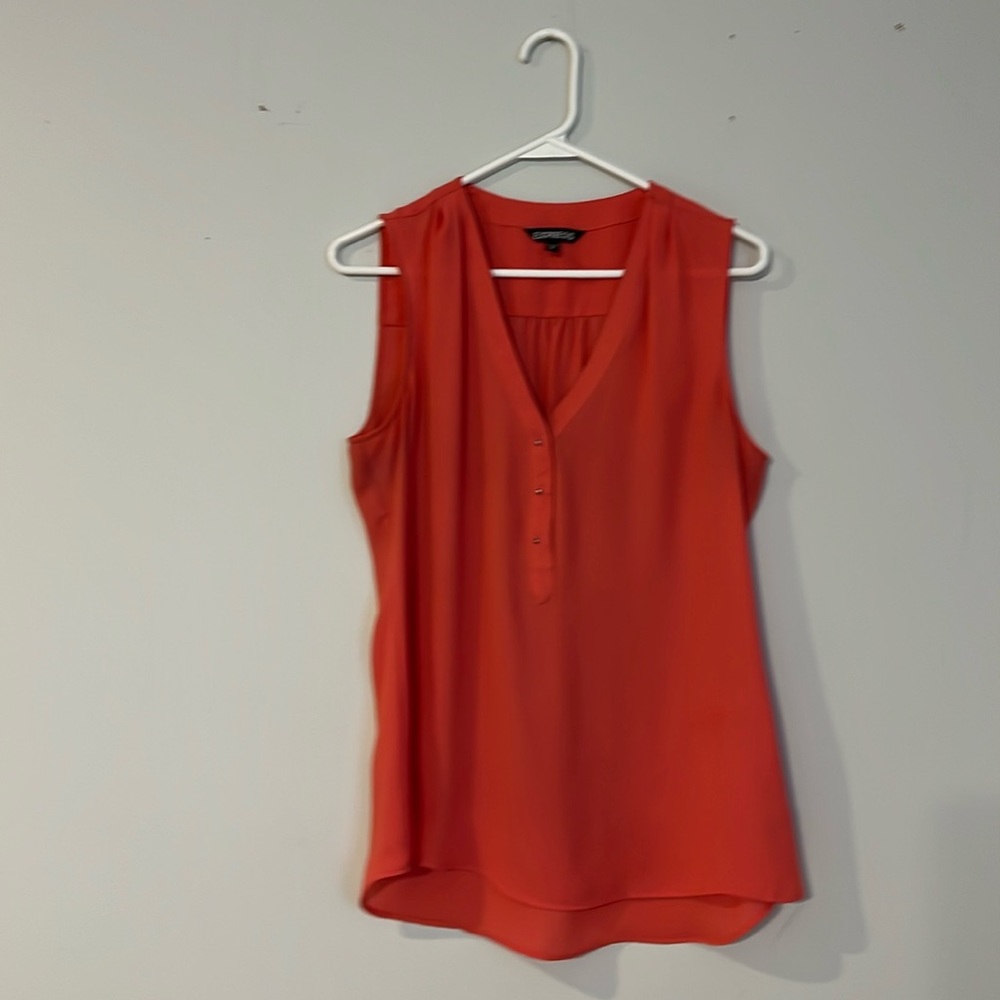 Coral blouse with small silver buttons